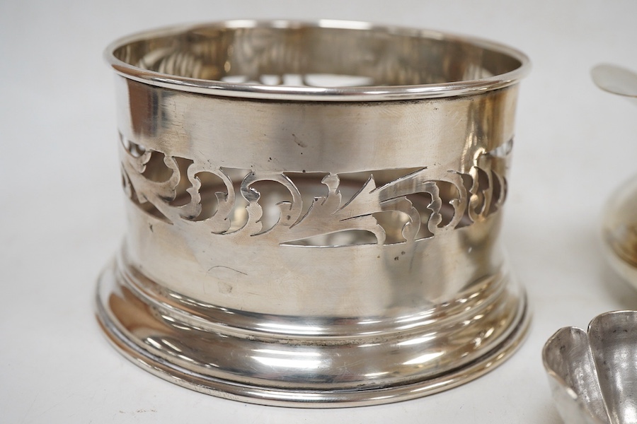 An Italian pierced 900 standard white metal bottle coaster, diameter 99mm, together with a sterling cream jug and a small 925 bowl, 9.9oz.